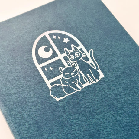 Jiji The Cat Journal in Ocean Blue with Holographic Edges and Logo 🌊✨

Product Details:

Size: A5 (5.70 x 8.26 inches)
160 Dotted Grid Pages (5 x 5 mm)
2 Bookmarks
Elastic Band and Pen Holder
Expandable storage compartment