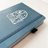 Jiji The Cat Journal in Ocean Blue with Holographic Edges and Logo 🌊✨

Product Details:

Size: A5 (5.70 x 8.26 inches)
160 Dotted Grid Pages (5 x 5 mm)
2 Bookmarks
Elastic Band and Pen Holder
Expandable storage compartment