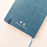 Jiji The Cat Journal in Ocean Blue with Holographic Edges and Logo 🌊✨

Product Details:

Size: A5 (5.70 x 8.26 inches)
160 Dotted Grid Pages (5 x 5 mm)
2 Bookmarks
Elastic Band and Pen Holder
Expandable storage compartment