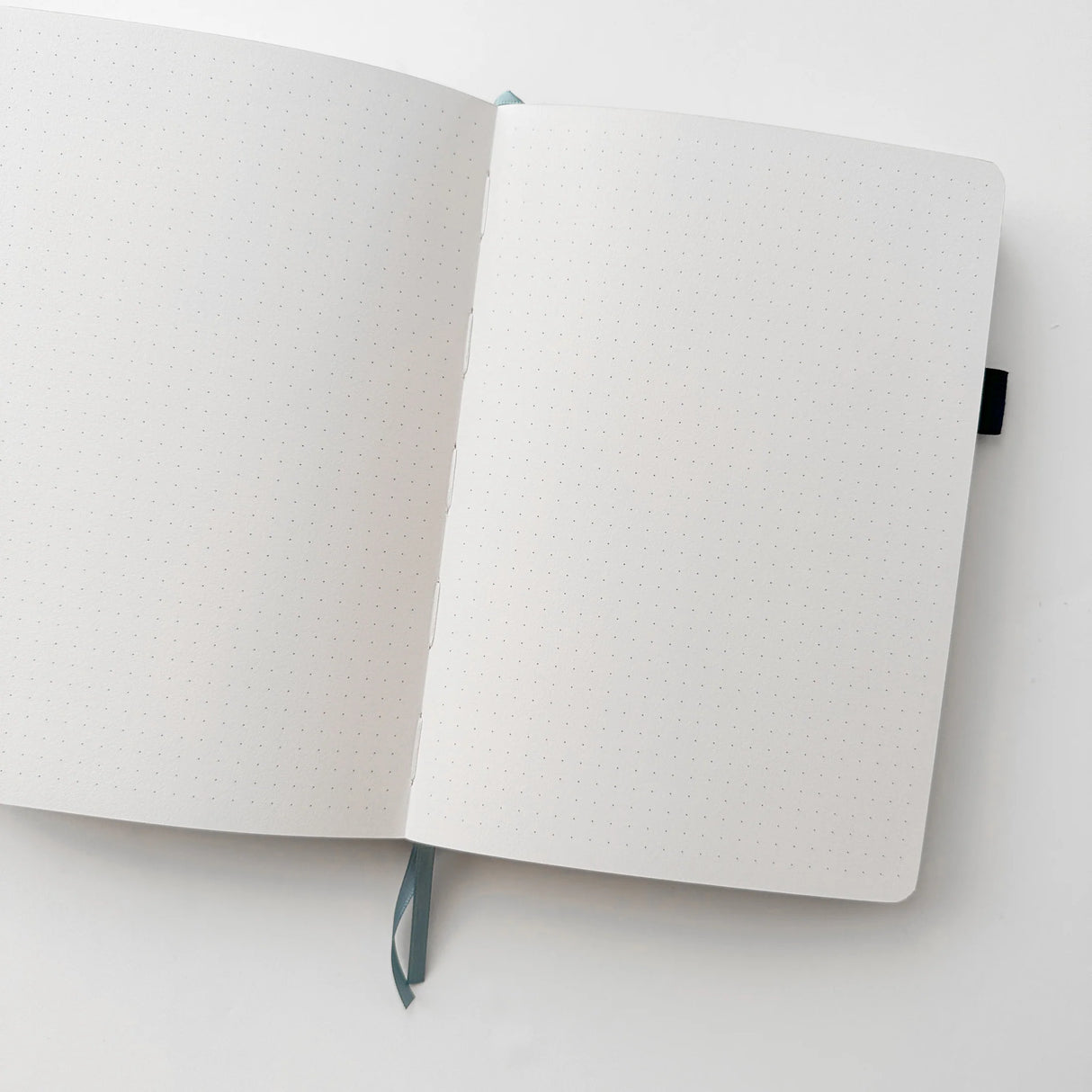 Jiji The Cat Journal in Ocean Blue with Holographic Edges and Logo 🌊✨

Product Details:

Size: A5 (5.70 x 8.26 inches)
160 Dotted Grid Pages (5 x 5 mm)
2 Bookmarks
Elastic Band and Pen Holder
Expandable storage compartment
