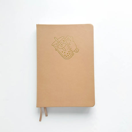 Milk Tea Journal in a beautiful, rich boba colour 🧋 with Gold Foil Logo ✨

Product Details:

Size: A5 (5.70 x 8.26 inches)
160 Dotted Grid Pages (5 x 5 mm)
2 Bookmarks
Elastic Band and Pen Holder
Expandable storage compartment