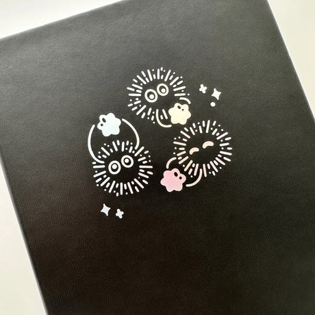Soot Spirits Journal with Holographic Edges and Logo! ✨

Product Details:

Size: A5 (5.70 x 8.26 inches)
160 Dotted Grid Pages (5 x 5 mm)
2 Bookmarks
Elastic Band and Pen Holder
Expandable storage compartment