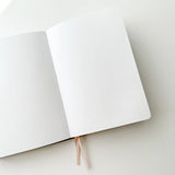 Soot Spirits Journal with Holographic Edges and Logo! ✨

Product Details:

Size: A5 (5.70 x 8.26 inches)
160 Dotted Grid Pages (5 x 5 mm)
2 Bookmarks
Elastic Band and Pen Holder
Expandable storage compartment