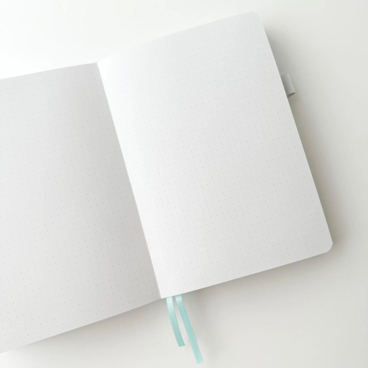 Soft pastel vegan leather bullet journal with delicate gold foil details, made to make your everyday planning feel a little more special ✨

Product Details:

Size: A5 (5.70 x 8.26 inches)
160 Dotted Grid Pages (5 x 5 mm)
2 Bookmarks
Elastic Band and Pen Holder
Expandable storage compartment