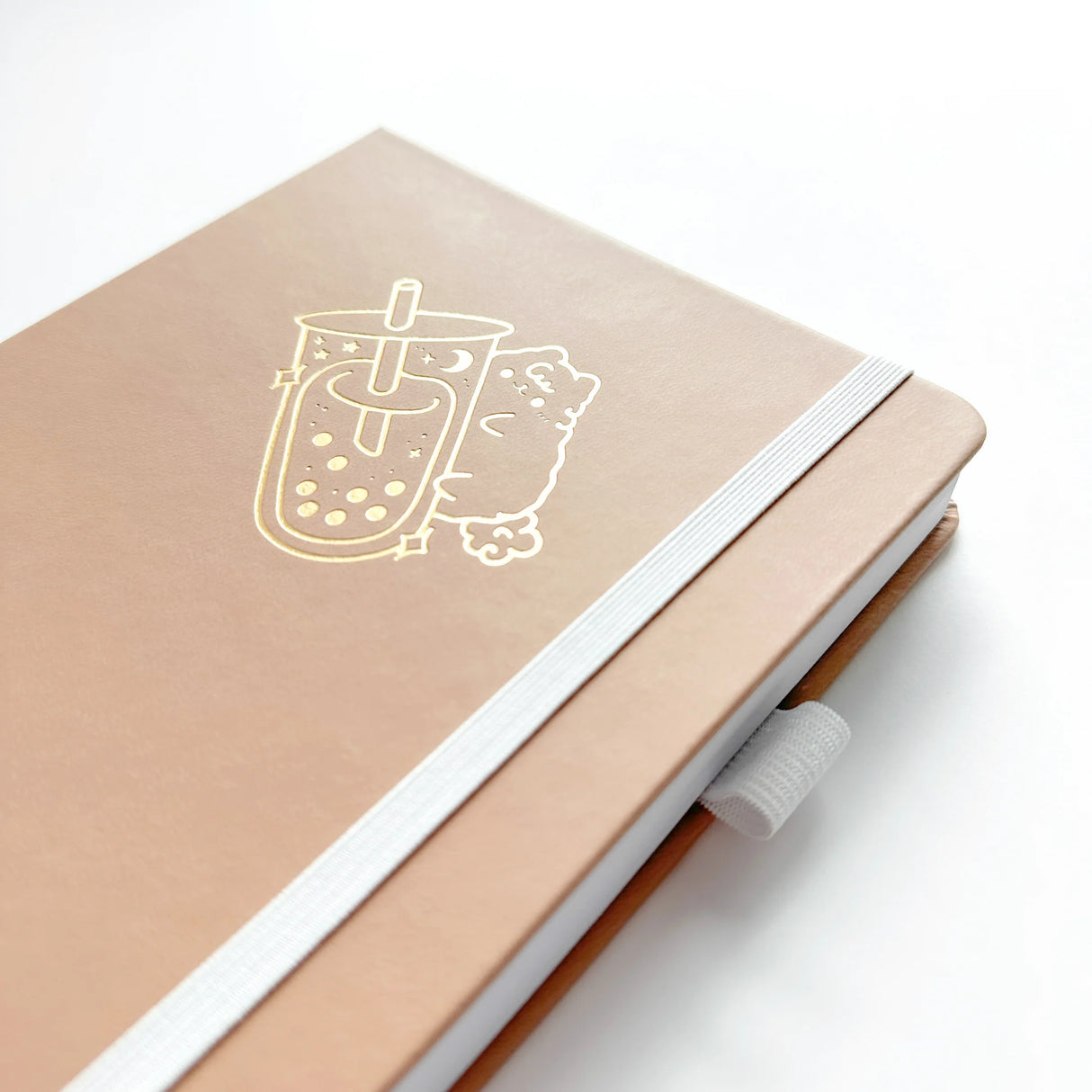 Milk Tea Journal in a beautiful, rich boba colour 🧋 with Gold Foil Logo ✨

Product Details:

Size: A5 (5.70 x 8.26 inches)
160 Dotted Grid Pages (5 x 5 mm)
2 Bookmarks
Elastic Band and Pen Holder
Expandable storage compartment