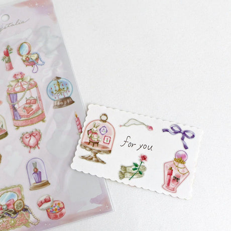 This is an illustration sticker that traps a fantasy world view and motif in a glass container like a snow globe or terrarium. It is a sparkling hologram specification.

• This package includes 1&nbsp;sheet of sticker
• Material: Transparent PET Hologram Lamination
• Package measures approx. H202 x W93 x D1mm
• Made in Japan