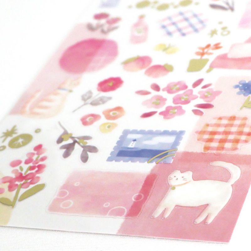 Sheet of decorative stickers with floral patterns, a cat, and other elements on a pink background.