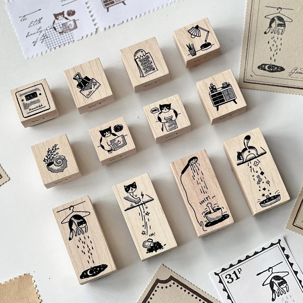 Meet the cat who makes Mondays magical. Our Mischievous Cat Stamp Set illustrates her morning routine—from coffee cup mischief to dramatic stretches and playful distractions. She’s cute, a little chaotic, and endlessly relatable. Use these stamps to decorate your spreads and give your week a lighthearted, whimsical start.

Easy to clean with ordinary alcohol wipe, alcohol gel, or special seal cleaner.

Brand: WT (The Washi Tape Shop)
Box size: 10cm × 10cm × 3.5cm
Stamp size:
22mm x 20mm x 4 pieces
22mm x 24