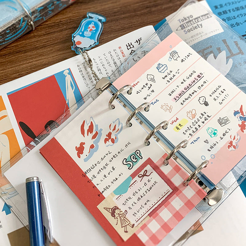 Molinta&nbsp;Binder - Goldfish Soda

Designed in a compact six‑ring format, this binder is perfect for organizing ephemera, sticker sheets, journaling inserts, and creative plans. Lightweight and easy to carry, this binder slips effortlessly into bags, totes, or your desk setup.

Specifications:

M5: 95mm x 128mm, 5 rings
A7: 102mm x 153mm, 6 rings

Includes soda keychain and elastic closure band.

Inserts not included