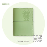 Molinta Six Ring Binder - Green

Stay organized in style with the Molinta 6‑Ring Binder, a compact and beautifully crafted cover designed for everyday notes, lists, sticker storage, and creative planning. Its warm brown tone gives it a classic, cozy feel, making it a perfect addition to any planner setup or stationery collection.

This binder is built in the A6, A7, or M5 size, making it wonderfully portable — easy to slip into bags, pouches, or carry on the go.

Specifications:

M5: 95mm x 128mm
A7: 102mm 