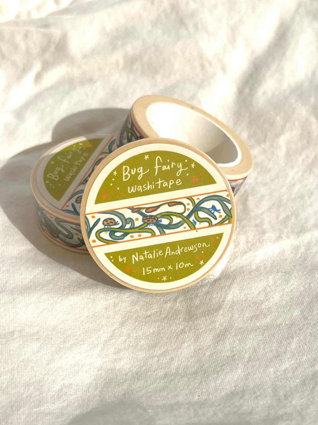 This washi tape features little bugs hidden in vines! Taken from the borders of my Bug Fairy print.

This roll is 15mm wide x 10m of paper tape. Washi tape is super durable and flexible. It tears easily and can be safely applied to a variety of surfaces; it doesn’t leave a sticky residue behind, making it especially ideal for stationery and hanging prints temporarily.