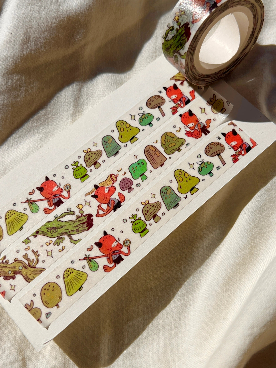 This washi tape features a little fox on their adventures through the mushroomy forest!

This roll is 15mm wide x 10m of paper tape. Washi tape is super durable and flexible. It tears easily and can be safely applied to a variety of surfaces; it doesn’t leave a sticky residue behind, making it especially ideal for stationery and hanging prints temporarily.