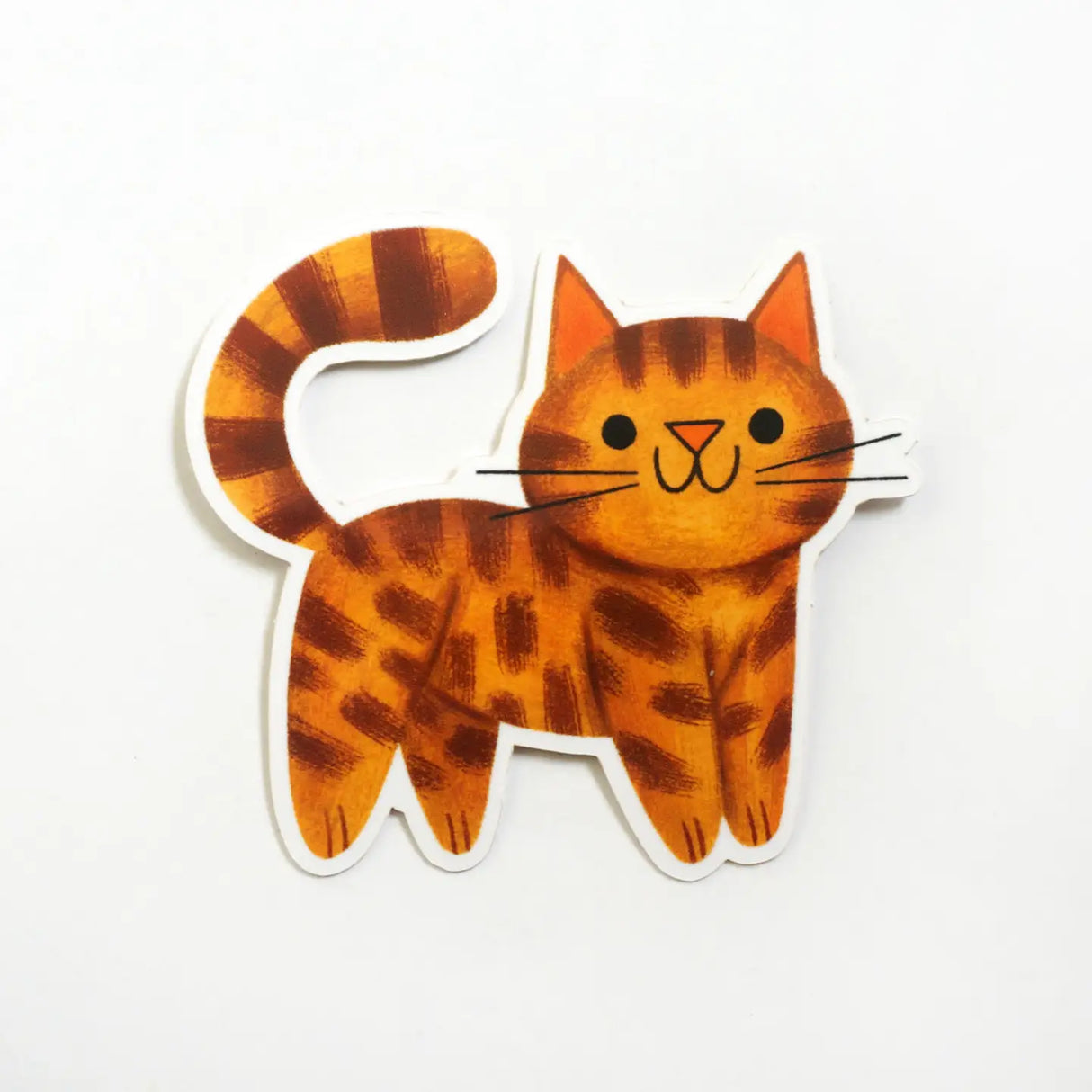 Sticker of a cartoon cat with orange and brown stripes on a white background