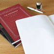High-quality notebooks are ideal for jotting down ideas, taking notes, sketching, making lists and more. They are perfect for use at home or the office.&nbsp;


Contains silky white, acid free paper that allows for effortless writing.
Notebooks available in ruled, grid and plain paper options.
Heavy duty covers feature a glitter accent.
Silver and gold foil text on the cover also decorate this upscale notebook.
Sturdy thread binding allows the notebook to lay flat for comfortable writing.
Red threading matc