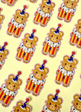 These adorable stickers feature a cute little bear in a clown suit.

These matte vinyl stickers feature an original design and are water, weather, and scratch proof. Perfect for putting on water bottles, computers or just about anywhere else.