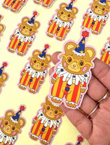 These adorable stickers feature a cute little bear in a clown suit.

These matte vinyl stickers feature an original design and are water, weather, and scratch proof. Perfect for putting on water bottles, computers or just about anywhere else.