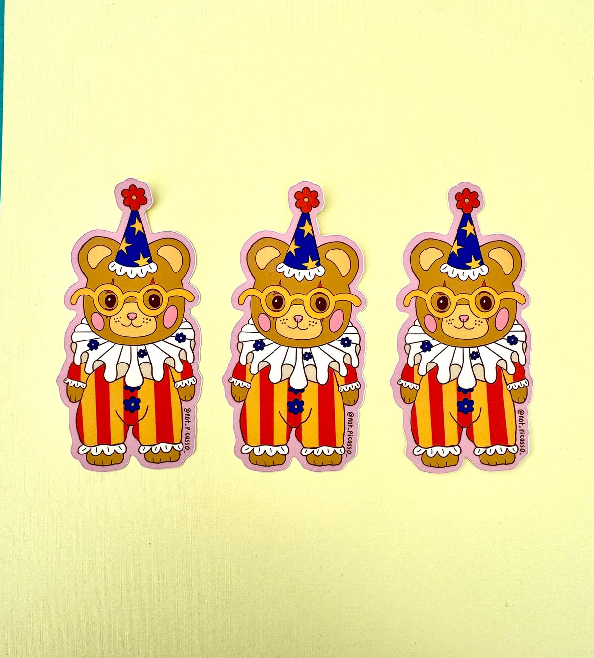 These adorable stickers feature a cute little bear in a clown suit.

These matte vinyl stickers feature an original design and are water, weather, and scratch proof. Perfect for putting on water bottles, computers or just about anywhere else.