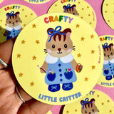 This adorable sticker is perfect for those who like to get a little crafty!

These matte vinyl stickers feature an original design and are water, weather, and scratch proof. Perfect for putting on water bottles, computers or just about anywhere else.