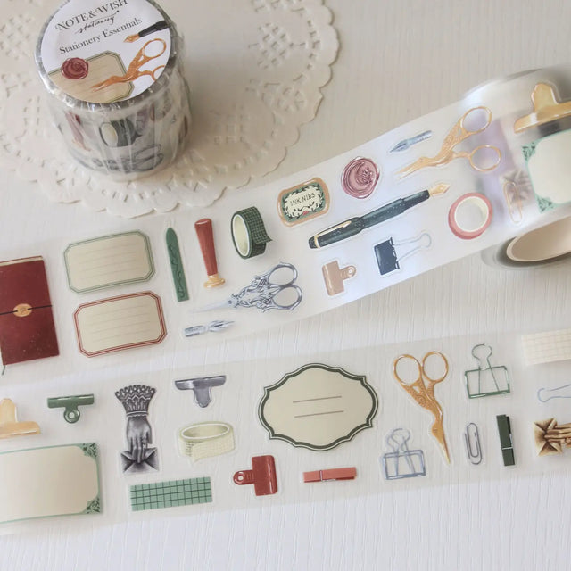 An updated version of our Stationery Essentials PET tape, now with a longer 50cm designer loop for even more creative possibilities.

This PET tape features hand-painted illustrations of vintage stationery such as wax seal stamps, fountain pens and ornate scissors. Designed by Rebecca and pre-cut for effortless use, it's perfect for journaling, collaging and adding a vintage aesthetic to any creative project.

Extra wide at 50mm with a matt transparent finish that layers cleanly over any background. No scis