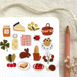OchMonika Spring Picnic Sticker Sheet

A matte paper sticker sheet filled with cozy, hand-drawn illustrations, perfect for planners, journals, or scrapbooking. It features a outdoor picnic and spring theme, making it a perfect fit for nature lovers and gift boutiques. All designs are lovingly created by Monika Szczerbińska.