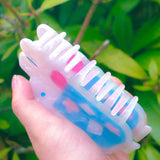 'Soda Float' Hair Claw featuring a blue soda float with rabbit shaped ice cream on top.

Made of acetate, 4 inches by 2 inches.

Hair claws come packaged in a plastic sleeve.