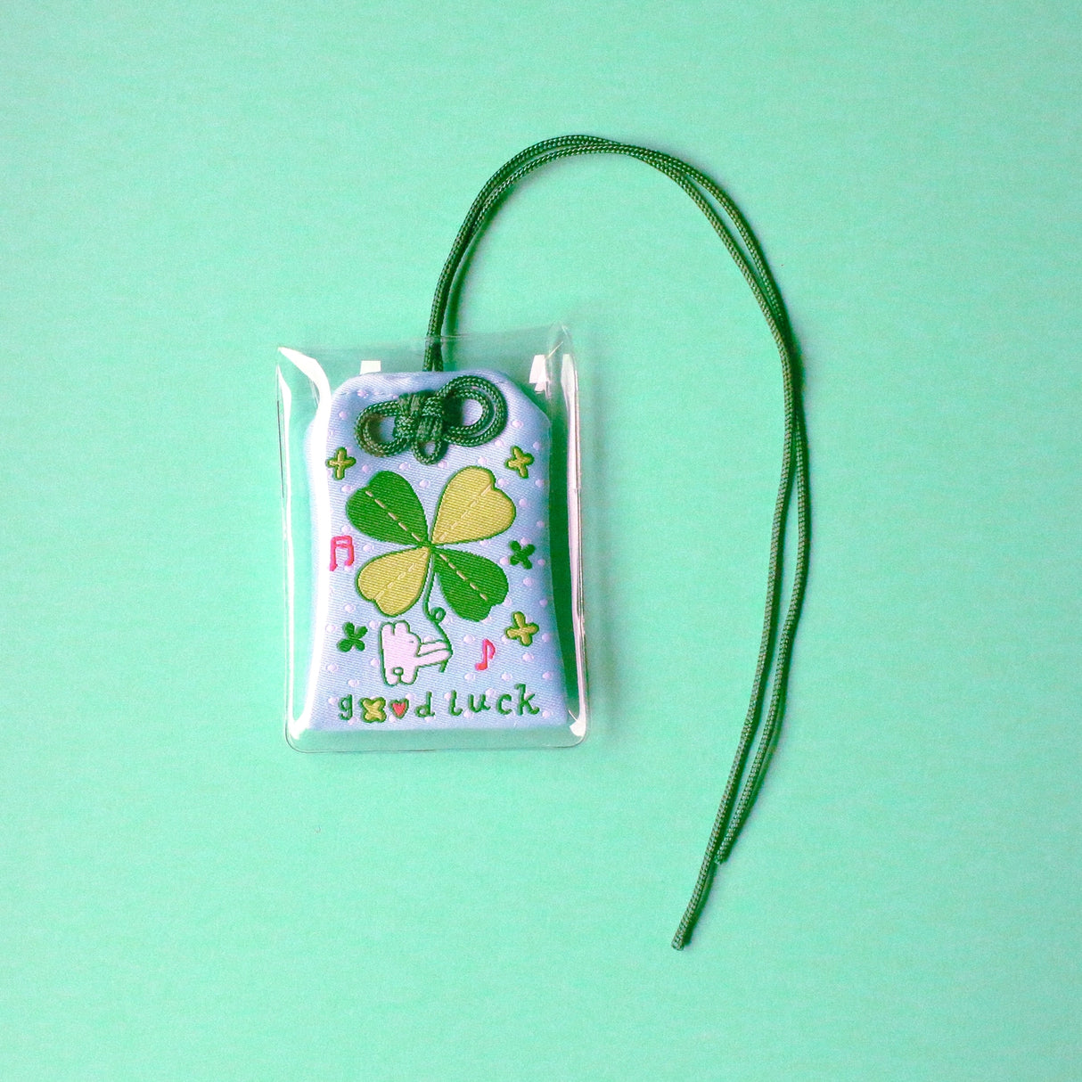 2x2.5 omamori charm with a 8 inch string.

An omamori is a Japanese charm that provides protection and luck!