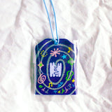 2x2.5 omamori charm with a 8 inch string.

An omamori is a Japanese charm that provides protection and luck!