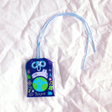 2x2.5 omamori charm with a 8 inch string.

An omamori is a Japanese charm that provides protection and luck!