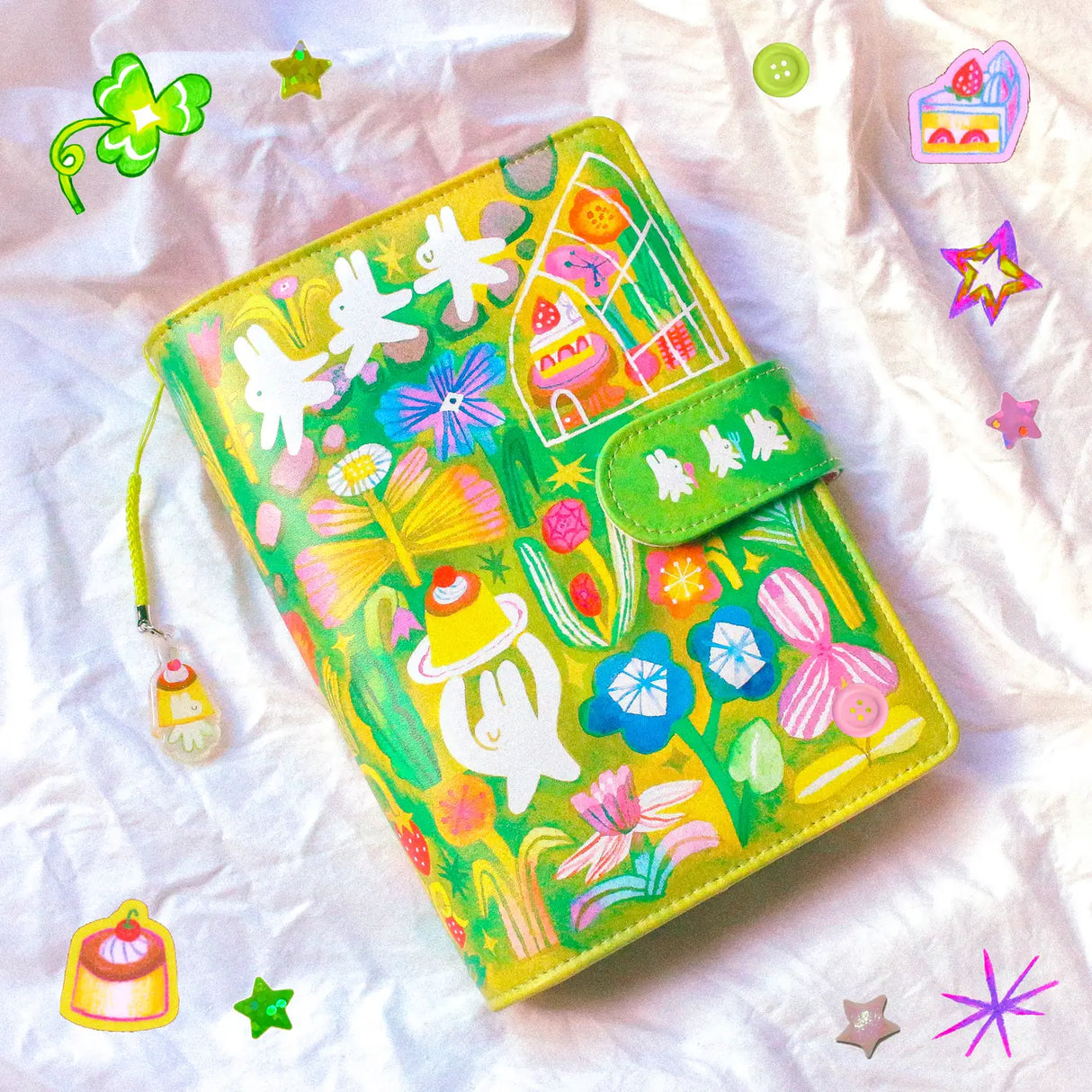 This is a A6 six ring binder that measures 14 cm x 19 cm when closed! It includes interior pockets for extra storage and a hole on the spine for charms.

This binder is great for storing stickers, sticker packs, note cards, photo cards, pet tape loops, ephemera and small sticker sheets. They can also be filled with paper and used as a notebook or journal.