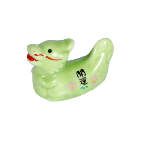 Porcelain oriental dragon chopstick rest / pen rest.
