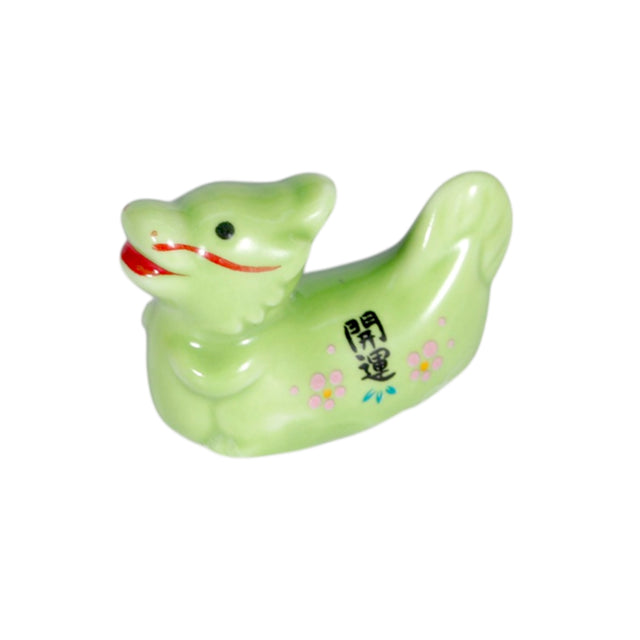 Porcelain oriental dragon chopstick rest / pen rest.