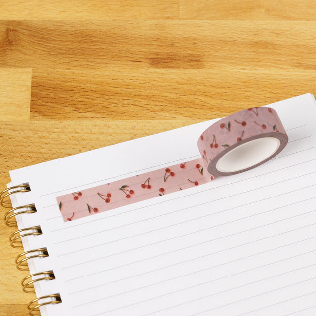 Painted Cherries Washi Tape

Our washi tape is made for paper lovers, pen pals, and anyone who gets butterflies in the stationery aisle. Perfect for journaling, scrapbooking, decorating envelopes, or adding a personal touch to planners and calendars. It's gentle on paper, easy to tear by hand, and removable without leaving residue, so you can rearrange, redo, and re-stick as needed.

Design Features:&nbsp;

Each roll measures 15mm wide on a 10m roll
Full color repeating pattern
Washi tape dispenser packagin