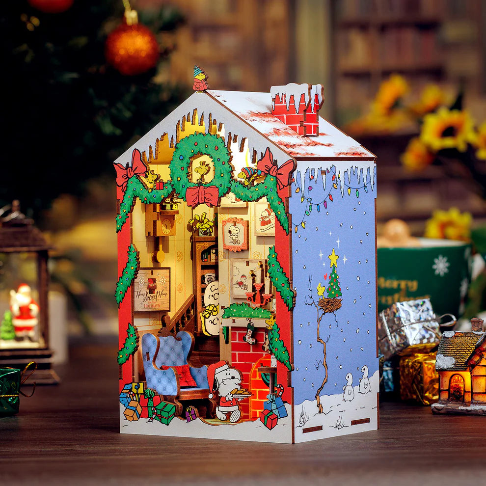 Snoopy Santa surprise! Bring the magic of the holidays to your bookshelf with this charming DIY book nook kit featuring Snoopy dressed as Santa! Caught cookie-handed, Snoopy steals the show while Charlie Brown and Sally peek from the stairs in festive wonder. With delightful details and nostalgic cheer, this cozy scene is perfect for Peanuts fans and holiday decorators alike.