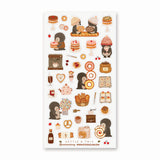 🍪🐧 At @nettleandtwig’s penguin cafe, a group of bundled-up penguins have gathered for the sweetest day out. They’re sharing warm baguettes, balancing towering bagels, and eyeing strawberry cakes. From flaky pastries and heart-shaped cookies to swirly rolls nearly bigger than they are, this charming sheet is pure bakery bliss. Grab a warm cocoa, pull up a tiny café chair, and let these penguin pals warm your heart.

Art by: @nettleandtwig

Top Coating: None
Adhesive Layer: PVC (plastic)
Backing Layer: Clea