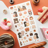 🍪🐧 At @nettleandtwig’s penguin cafe, a group of bundled-up penguins have gathered for the sweetest day out. They’re sharing warm baguettes, balancing towering bagels, and eyeing strawberry cakes. From flaky pastries and heart-shaped cookies to swirly rolls nearly bigger than they are, this charming sheet is pure bakery bliss. Grab a warm cocoa, pull up a tiny café chair, and let these penguin pals warm your heart.

Art by: @nettleandtwig

Top Coating: None
Adhesive Layer: PVC (plastic)
Backing Layer: Clea