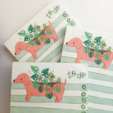 In a sunny Wildflower Woods cottage, a dachshund planter rests near a stack of well-loved books, leafy greens spilling gently from its back. This notepad brings that cozy, decorative moment to your desk, making everyday lists feel a little more inviting.

Designed to be practical without feeling busy, this notepad offers a simple, cheerful way to keep track of daily to-do lists and planning.