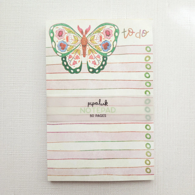 In the gardens of Wildflower Woods, a butterfly drifts from bloom to bloom, wings patterned with flowers gathered along the way. This notepad brings that light, floral moment to your desk, making everyday lists feel a little more inviting.

Designed to be practical without feeling busy, this notepad offers a simple, cheerful way to keep track of daily to-do lists and planning.