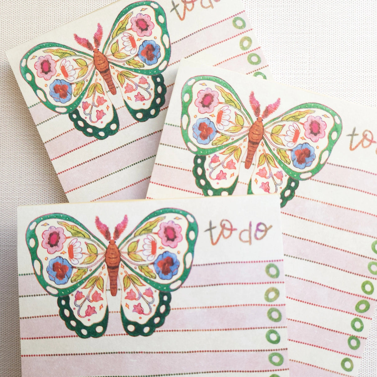 In the gardens of Wildflower Woods, a butterfly drifts from bloom to bloom, wings patterned with flowers gathered along the way. This notepad brings that light, floral moment to your desk, making everyday lists feel a little more inviting.

Designed to be practical without feeling busy, this notepad offers a simple, cheerful way to keep track of daily to-do lists and planning.