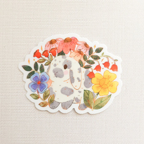 A charming dachshund planter rests among leafy greenery, a thriving cheese plant growing from its back like a small piece of playful décor. This vinyl sticker captures that cozy, plant-filled still life, adding a touch of warmth and whimsy to your everyday essentials.

Made from durable, waterproof vinyl, this sticker is designed to hold up wherever you place it—whether that’s a water bottle, laptop, or journal you reach for daily.