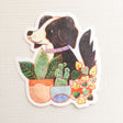 A loyal dog settles in among leafy houseplants, content to rest where sunlight filters softly through the greenery. This vinyl sticker captures that familiar, cozy moment, adding a quiet sense of companionship to your everyday essentials.

Made from durable, waterproof vinyl, this sticker is designed to hold up wherever you place it—whether that’s a water bottle, laptop, or journal you reach for daily.