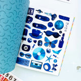 Your sticker stash is about to get very color-coordinated 🌈 Sticker the Rainbow Book Vol. 2: In Real Life is packed with 1500+ photorealistic stickers in every shade imaginable, from juicy lemons and shiny silver treasures to butterflies, vintage objects, florals, gems, and colorful everyday finds. With 30 pages of ultra-realistic stickers (plus 4 pages of alphabet + number stickers!), this book is basically a rainbow treasure hunt for your journal, planner, snail mail, laptop, or craft cart.