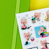 These busy little piggies are getting things done! The Piggy Little Helpers Pipstickers sheet features adorable pink pig characters tackling everyday tasks—watering plants, tidying up, crafting, cooking, and more. Each sticker is full of tiny details and soft pastel colors that make them perfect for planners, junk journals, snail mail, notebooks, and creative projects.