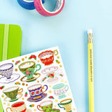 Pour yourself a little moment of cozy—these charming teacup stickers are serving up vintage vibes with a colorful Pipsticks twist. Each design features beautifully detailed cups, saucers, and tiny treats, with playful patterns, delicate florals, and pops of gold that make every sticker feel like a mini work of art. Perfect for adding a touch of tea party magic to planners, journals, letters, or anywhere that could use a little extra sweetness.