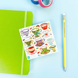 Pour yourself a little moment of cozy—these charming teacup stickers are serving up vintage vibes with a colorful Pipsticks twist. Each design features beautifully detailed cups, saucers, and tiny treats, with playful patterns, delicate florals, and pops of gold that make every sticker feel like a mini work of art. Perfect for adding a touch of tea party magic to planners, journals, letters, or anywhere that could use a little extra sweetness.
