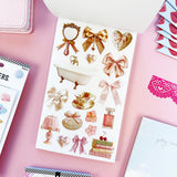 Sweet, nostalgic, and a little bit extra—in the best way. The Coquette Junk Journal Sticker Book is packed with all the pretty details your pages have been waiting for. Think bows, florals, frames, patterns, alphabets, and darling vintage-inspired bits made for layering, collaging, and documenting every little moment.