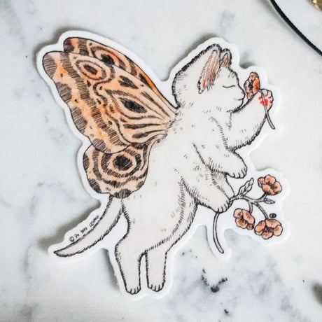 A gentle kitty with butterfly wings pauses to admire a flower, bringing a touch of magic and wonder. This enchanting design is perfect for fairy lovers, cat enthusiasts, and anyone who adores whimsical details. Printed on durable white vinyl, this sticker is waterproof, UV-proof, and long-lasting — ideal for decorating water bottles, laptops, journals, or gifts.