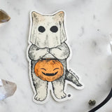 A cat dressed as a ghost for the spooky season, getting ready to go trick or treating! This whimsical illustration blends holiday spirit and magic, making it a perfect sticker for anyone who loves enchanting details. Printed on durable white vinyl, this sticker is waterproof, UV-proof, and made to last — ready to decorate laptops, journals, bottles, and more.