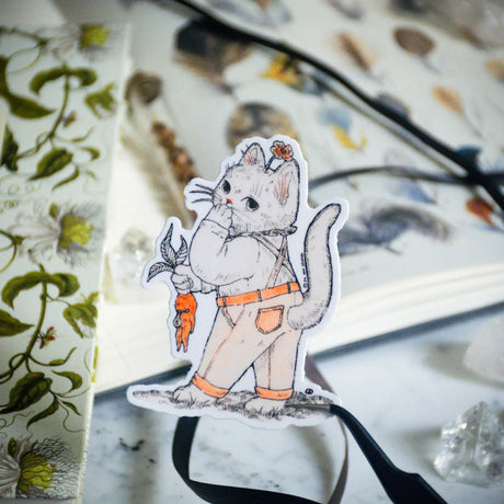 This sweet little kitty has found themself in a bit of a garden mishap. Illustrated in a whimsical pen-and-ink style with a soft vintage touch, “Oops Kitty” brings charm and a smile wherever it goes. Printed on durable white vinyl, this sticker is waterproof, UV-proof, and long-lasting — perfect for decorating water bottles, laptops, journals, or anywhere a touch of magic is needed.