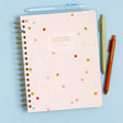 Stay organized and inspired with the Professional Overthinker Spiral Notebook! Featuring lined pages for all your thoughts, lists, and brainstorms, this 7” x 9” wire-bound notebook is perfect for journaling, note-taking, or planning your next big idea. The playful cover design makes it a great desk companion or a fun gift for students, writers, teachers, or anyone who loves to jot things down. Whether you’re tackling to-do lists or letting your creativity flow, this stylish and functional notebook is here t