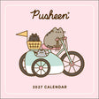 Enjoy 12 months of snacks, naps, and fun with Pusheen the cat!

Smartly sized for cozy corners, busy bulletin boards, or any small spaces, the Pusheen 2027 Mini Wall Calendar adds just the right amount of color, cuteness, and creative organization wherever you need it.

Features include:


7" x 7" (7" x 14" open)—a great size for small spaces
Cover design eliminates need for plastic packaging
Printed on FSCÂ®-certified paper with soy-based ink
Planning spread for September–December 2026
Spans January–Decemb